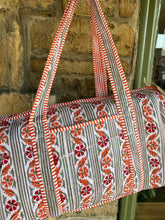 Load image into Gallery viewer, Block-printed and quilted overnight bag.
